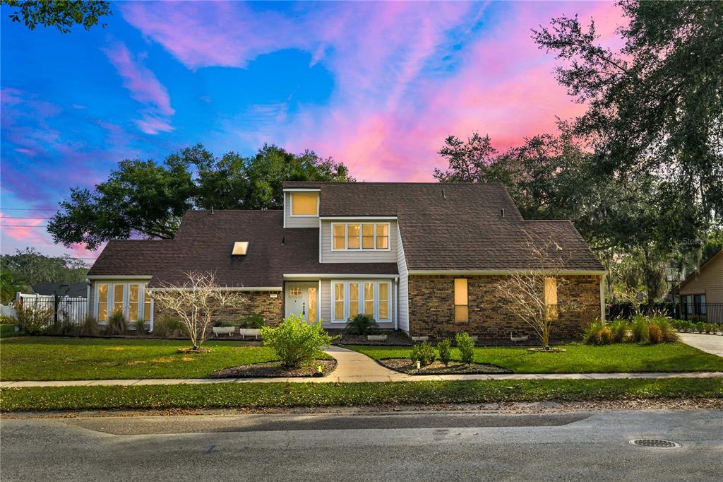 4951 Courtland Loop Winter Springs, FL 32708 - Photo 1 of 36 a front view of a house with a yard