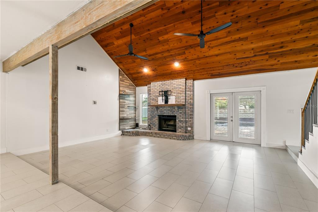 4951 Courtland Loop Winter Springs, FL 32708 - Photo 13 of 36 a view of a livingroom with a fireplace and window