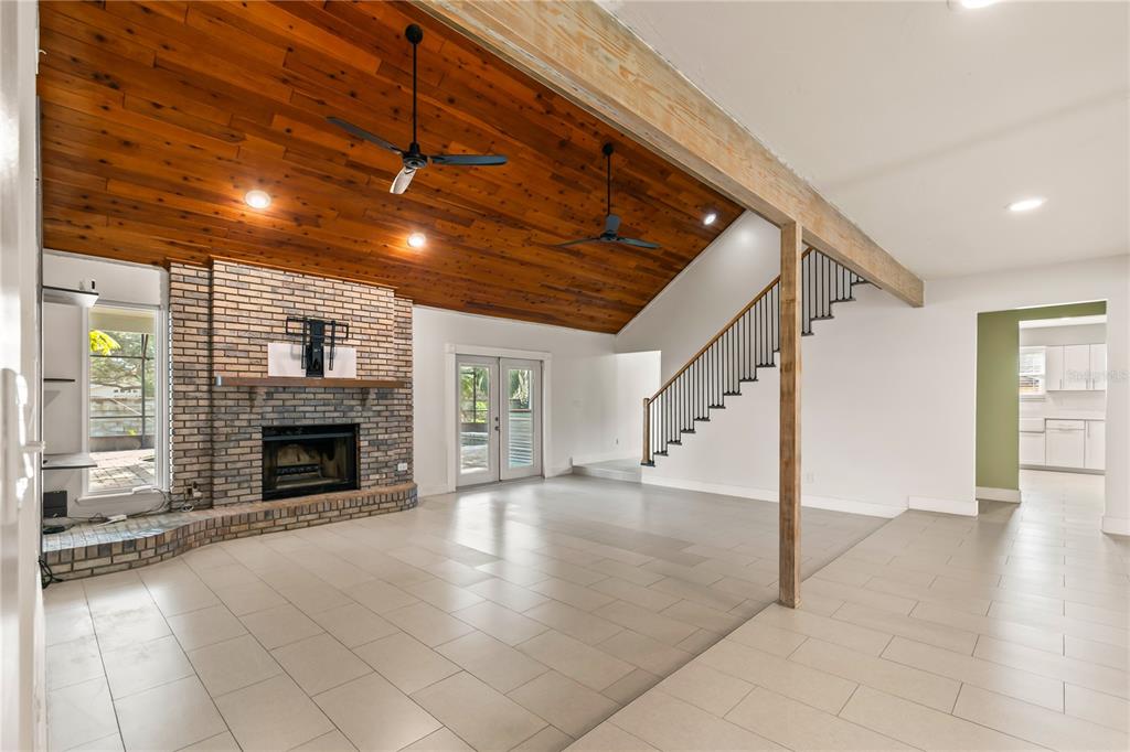 4951 Courtland Loop Winter Springs, FL 32708 - Photo 14 of 36 a view of an empty room with fireplace and a window