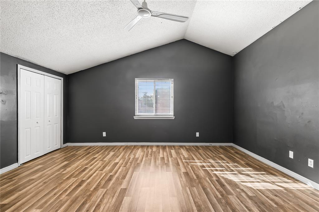 4951 Courtland Loop Winter Springs, FL 32708 - Photo 25 of 36 a view of a big room with wooden floor and windows