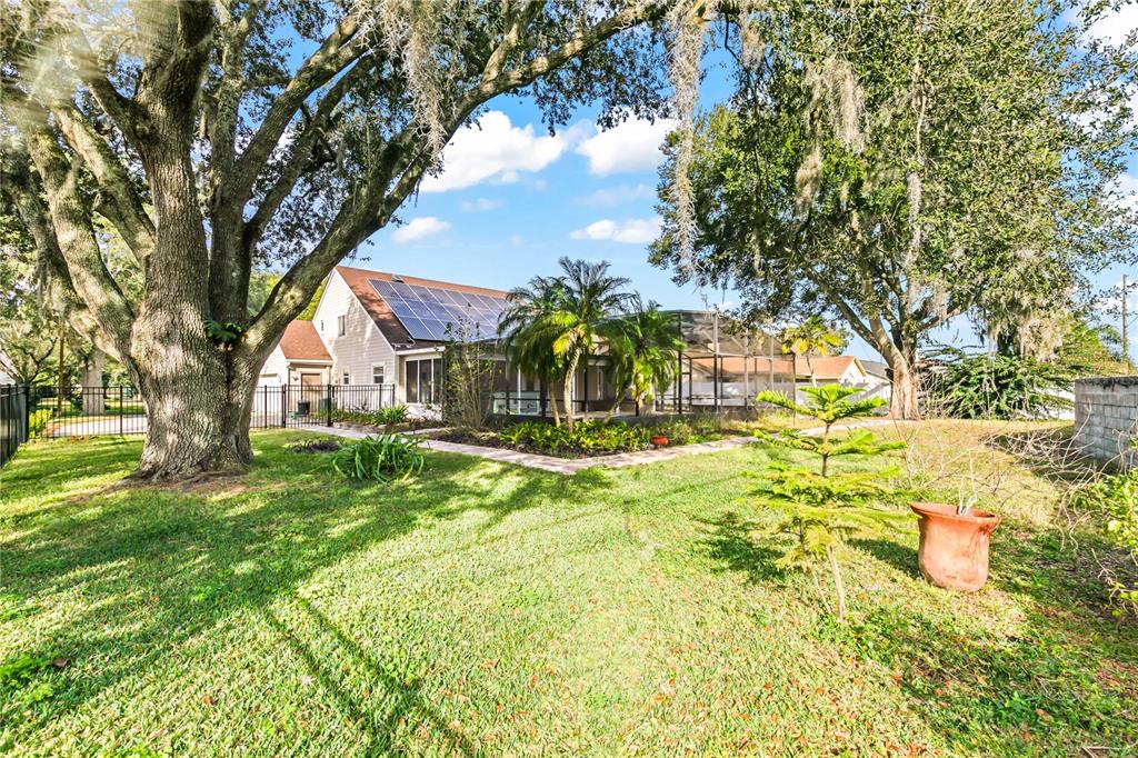 4951 Courtland Loop Winter Springs, FL 32708 - Photo 27 of 36 a view of swimming pool with a garden