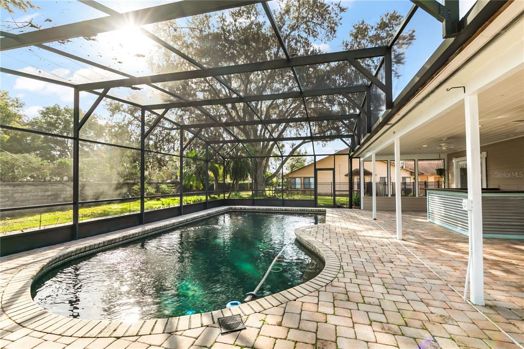4951 Courtland Loop Winter Springs, FL 32708 - Photo 30 of 36 a view of a swimming pool with a patio