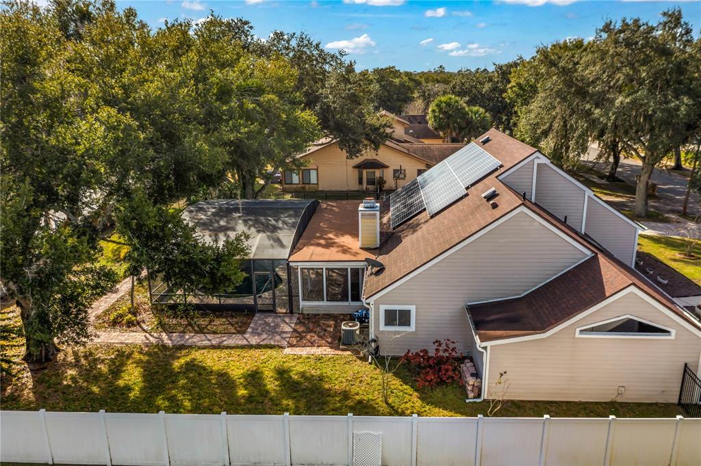 4951 Courtland Loop Winter Springs, FL 32708 - Photo 36 of 36 an aerial view of a house with swimming pool and large trees