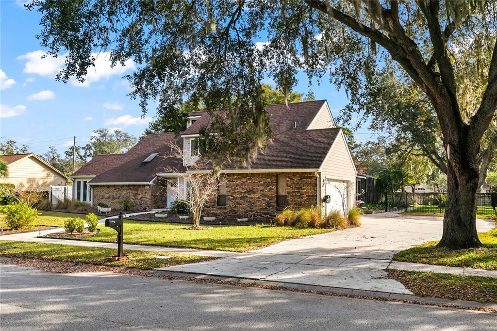 4951 Courtland Loop Winter Springs, FL 32708 - Photo 6 of 36 a view of a house with a small yard