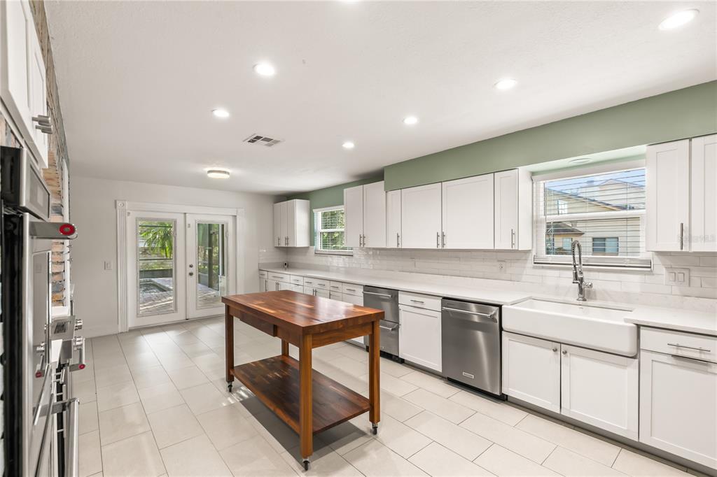 4951 Courtland Loop Winter Springs, FL 32708 - Photo 10 of 36 a kitchen with a sink cabinets and window