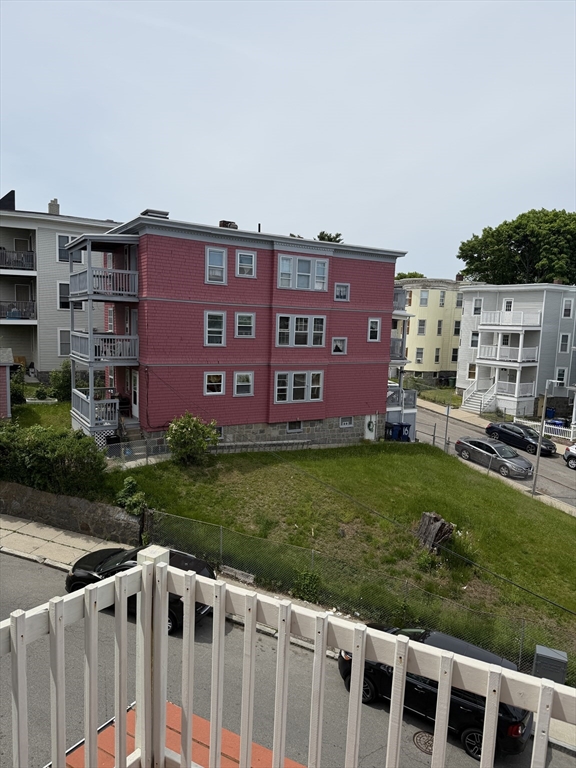 8 Ogden Street Boston, MA 02124 - Photo 20 of 20 a view of a yard with a large building