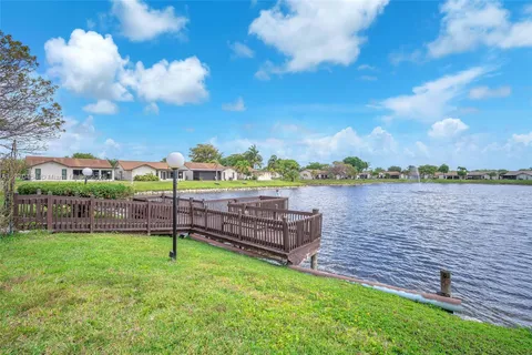 a view of a lake with a yard