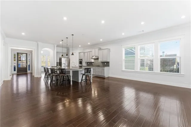a view of a dining room with furniture and wooden floor