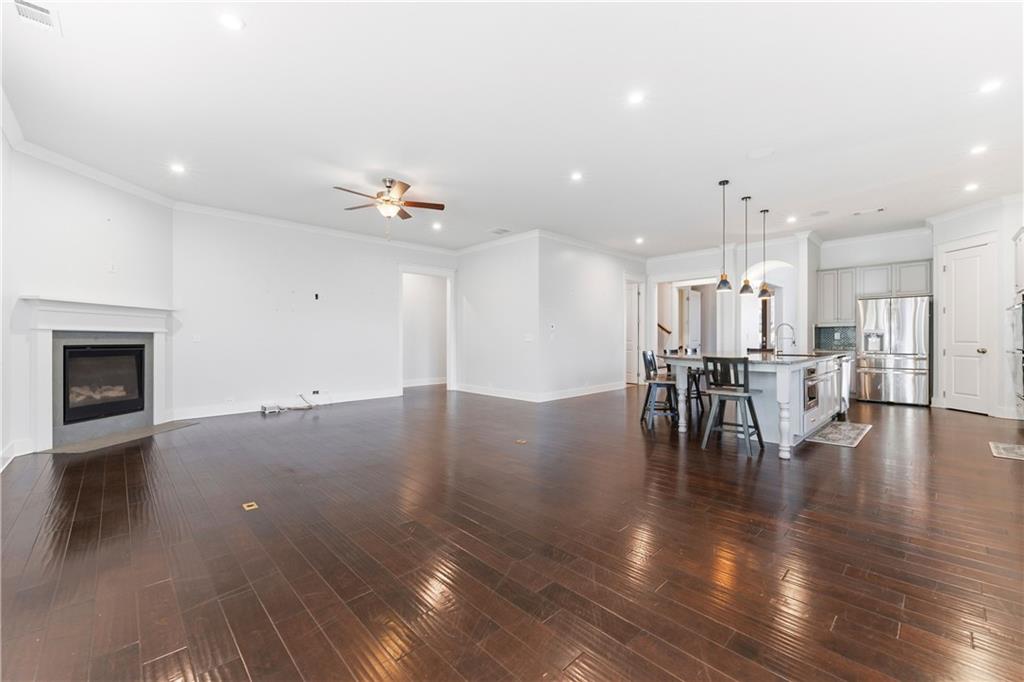 601 Long Leaf Way Canton, GA 30114 - Photo 16 of 42 a view of dining room with furniture and wooden floor