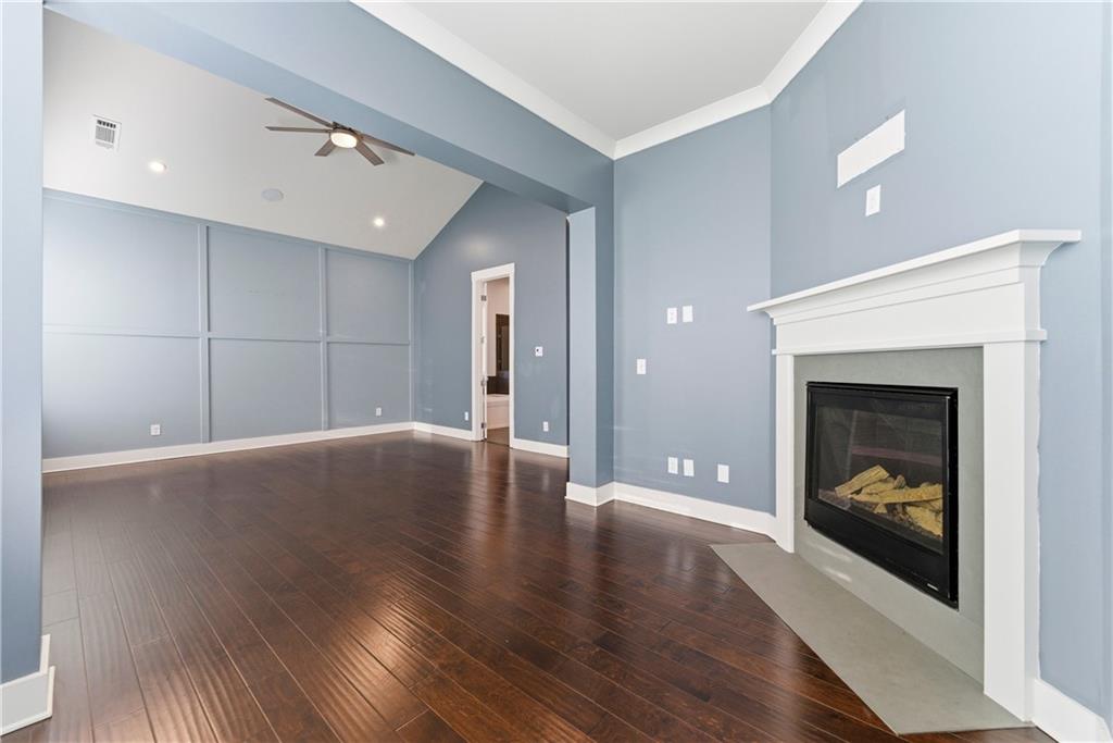 601 Long Leaf Way Canton, GA 30114 - Photo 21 of 42 a view of a livingroom with wooden floor and a fireplace