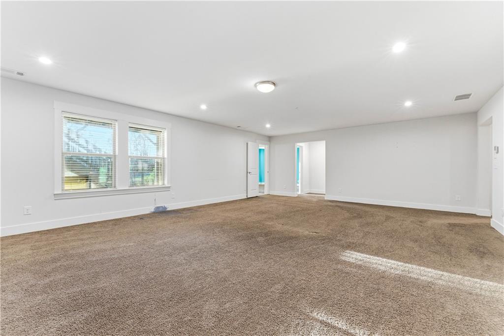 601 Long Leaf Way Canton, GA 30114 - Photo 28 of 42 an empty room with windows