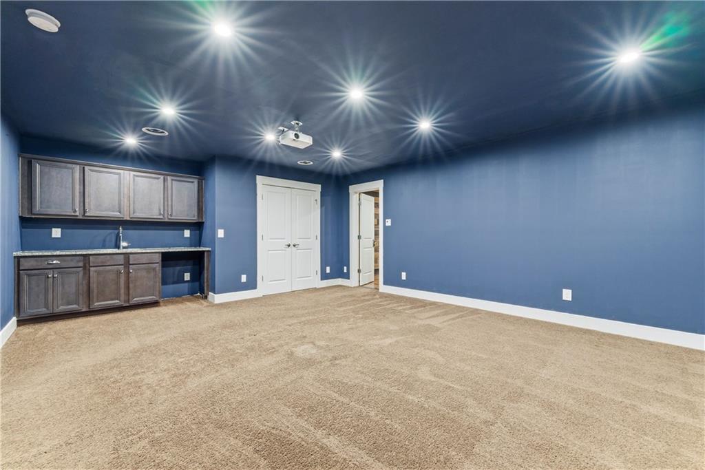 601 Long Leaf Way Canton, GA 30114 - Photo 32 of 42 a view of an empty room with kitchen and a window