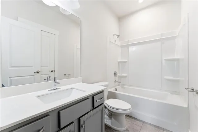 a bathroom with a sink a toilet and a bathtub