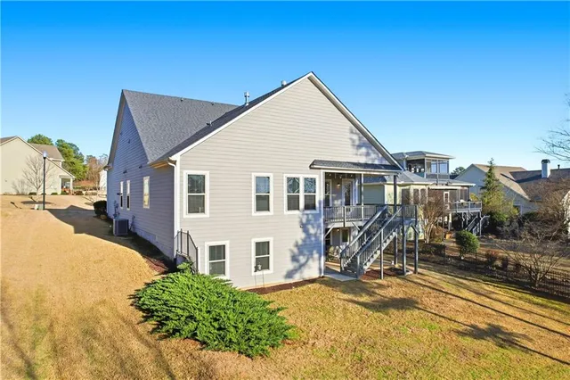 a view of a house with yard and sitting area