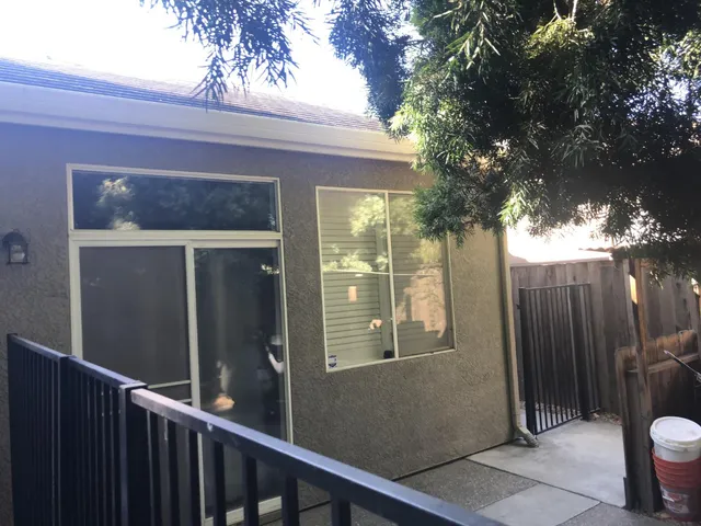 a view of a door and a tree