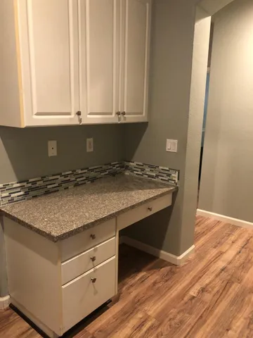 a view of kitchen island with wooden floor