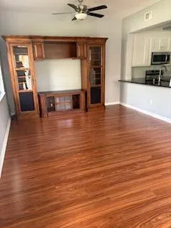 a view of a kitchen with microwave and cabinets
