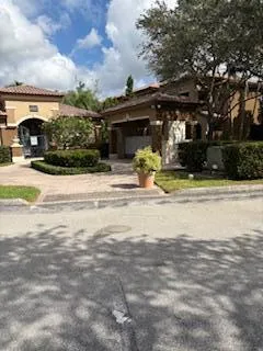a view of a fountain in front of a house