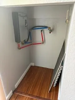 a view of storage and utility room with racks on the wall