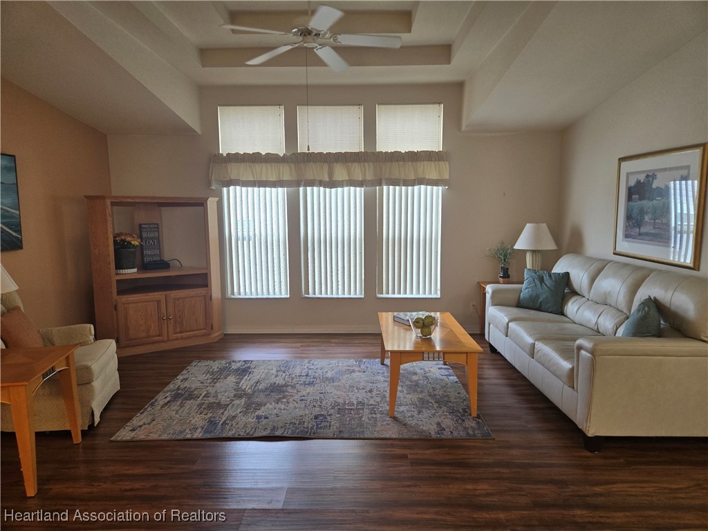 3312 Beartooth Pass Sebring, FL 33872 - Photo 8 of 39 a living room with furniture and a wooden floor
