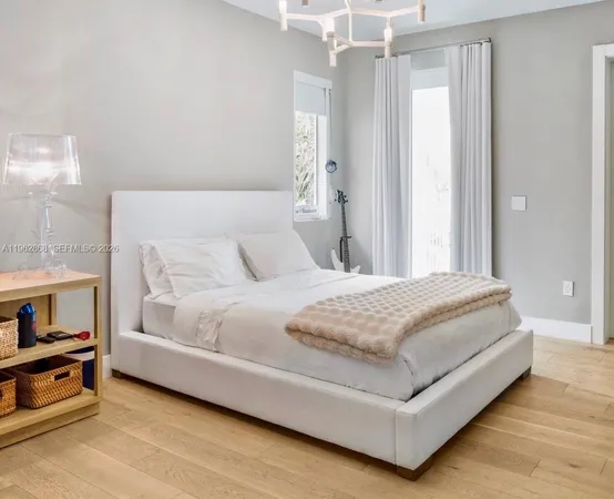 a bathroom with a sink toilet vanity and tub