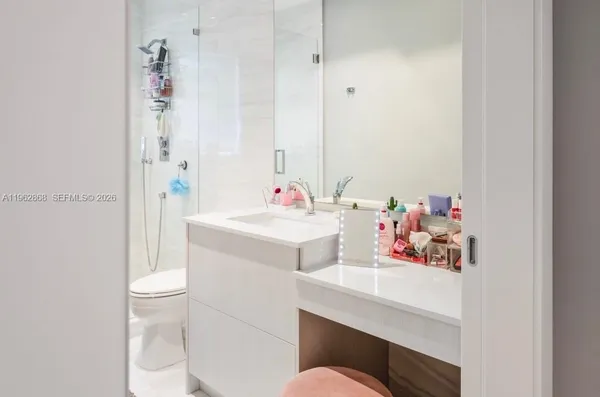 a bedroom with a bed chair and a window