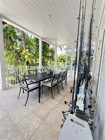 a view of a swimming pool with sitting area