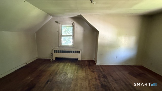 131 Bryden Terrace Hamden, CT 06517 - Photo 15 of 16 an empty room with wooden floor and windows