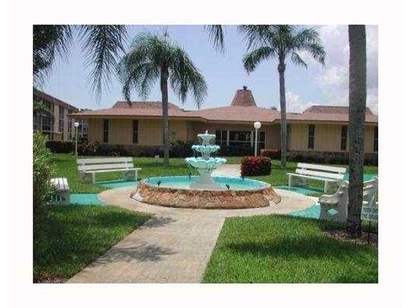 500 Village Green Circle West, Unit 107 Palm Springs, FL 33461 - Photo 12 of 24 Clubhouse front
