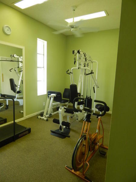 500 Village Green Circle West, Unit 107 Palm Springs, FL 33461 - Photo 17 of 24 Exercise room