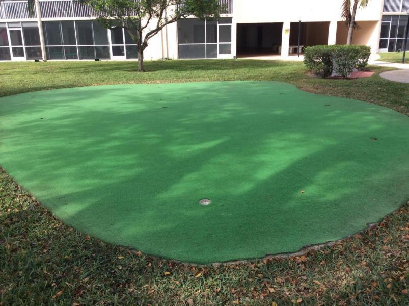 500 Village Green Circle West, Unit 107 Palm Springs, FL 33461 - Photo 20 of 24 Putting green