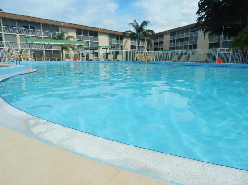 500 Village Green Circle West, Unit 107 Palm Springs, FL 33461 - Photo 24 of 24 Poolside edge