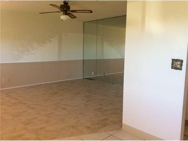 500 Village Green Circle West, Unit 107 Palm Springs, FL 33461 - Photo 5 of 24 Living room 2