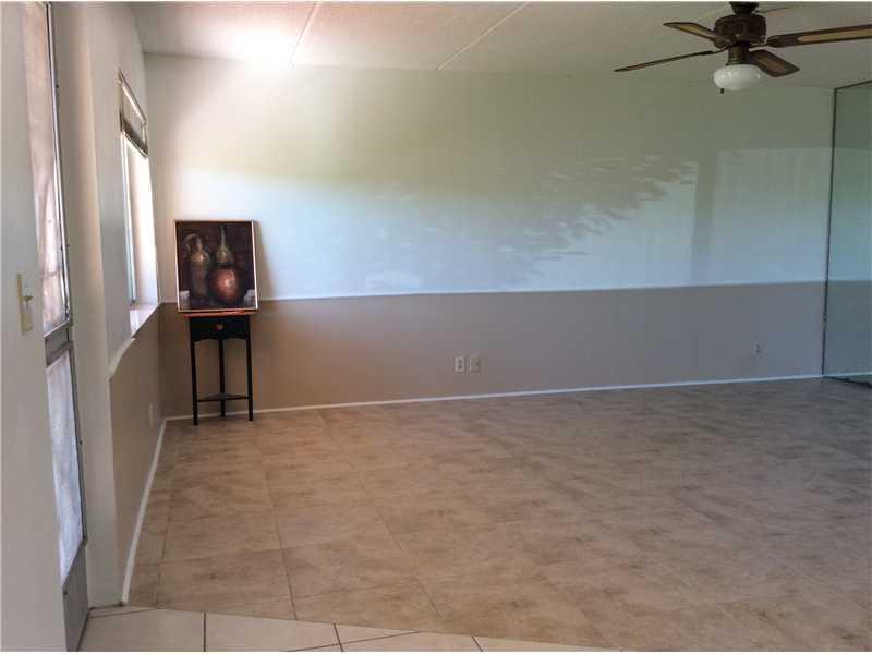 500 Village Green Circle West, Unit 107 Palm Springs, FL 33461 - Photo 6 of 24 Living room