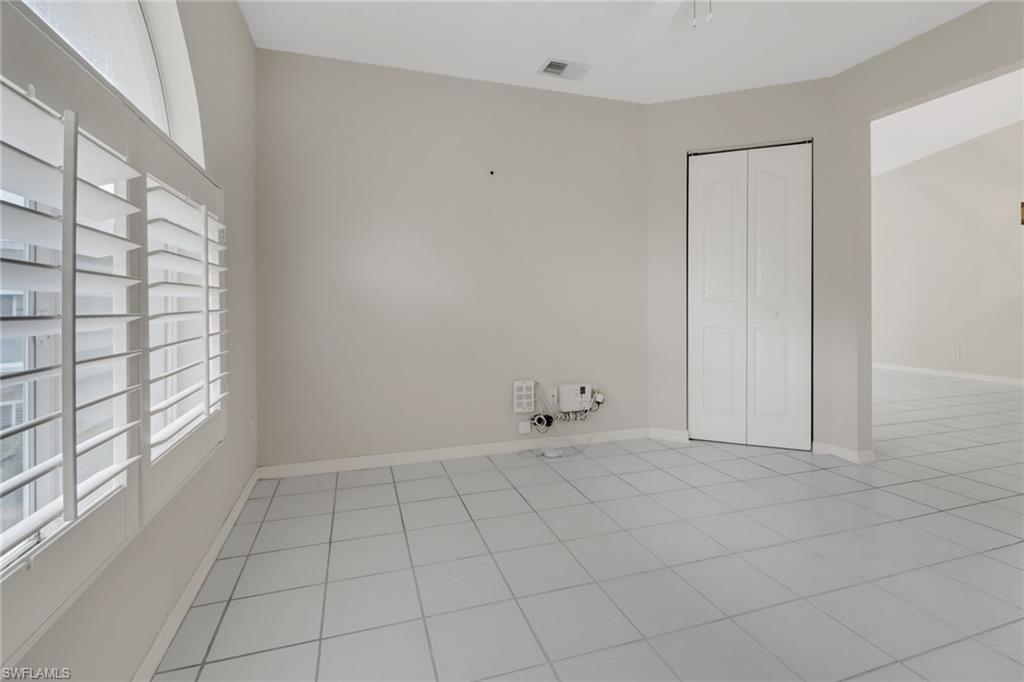 875 New Waterford Drive, Unit T201 Naples, FL 34104 - Photo 15 of 25 a view of an empty room and window