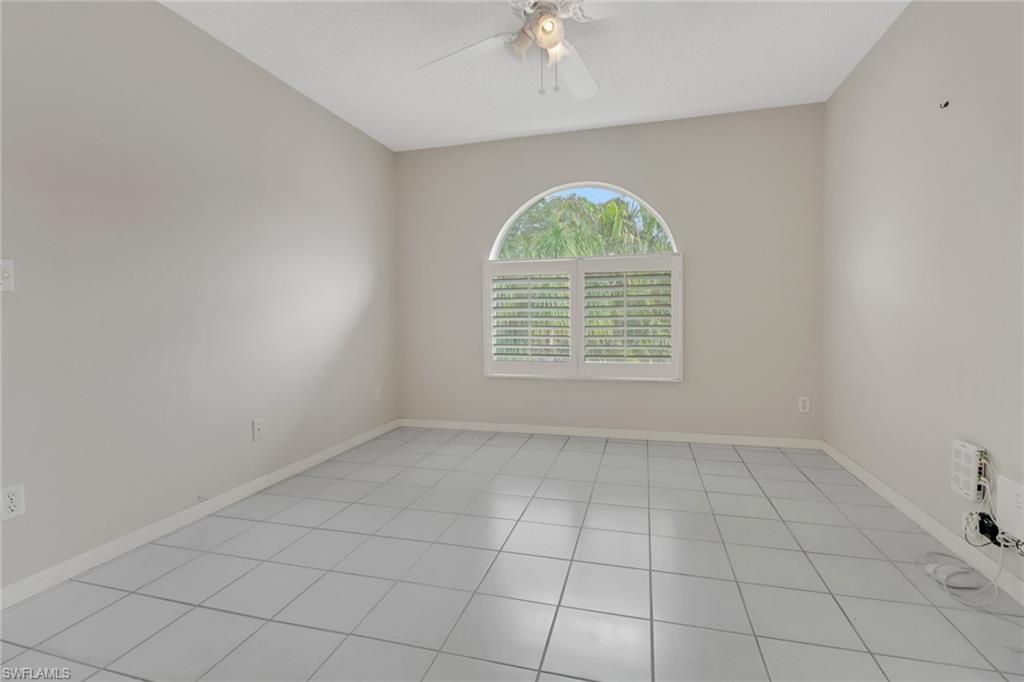 875 New Waterford Drive, Unit T201 Naples, FL 34104 - Photo 16 of 25 an empty room with windows