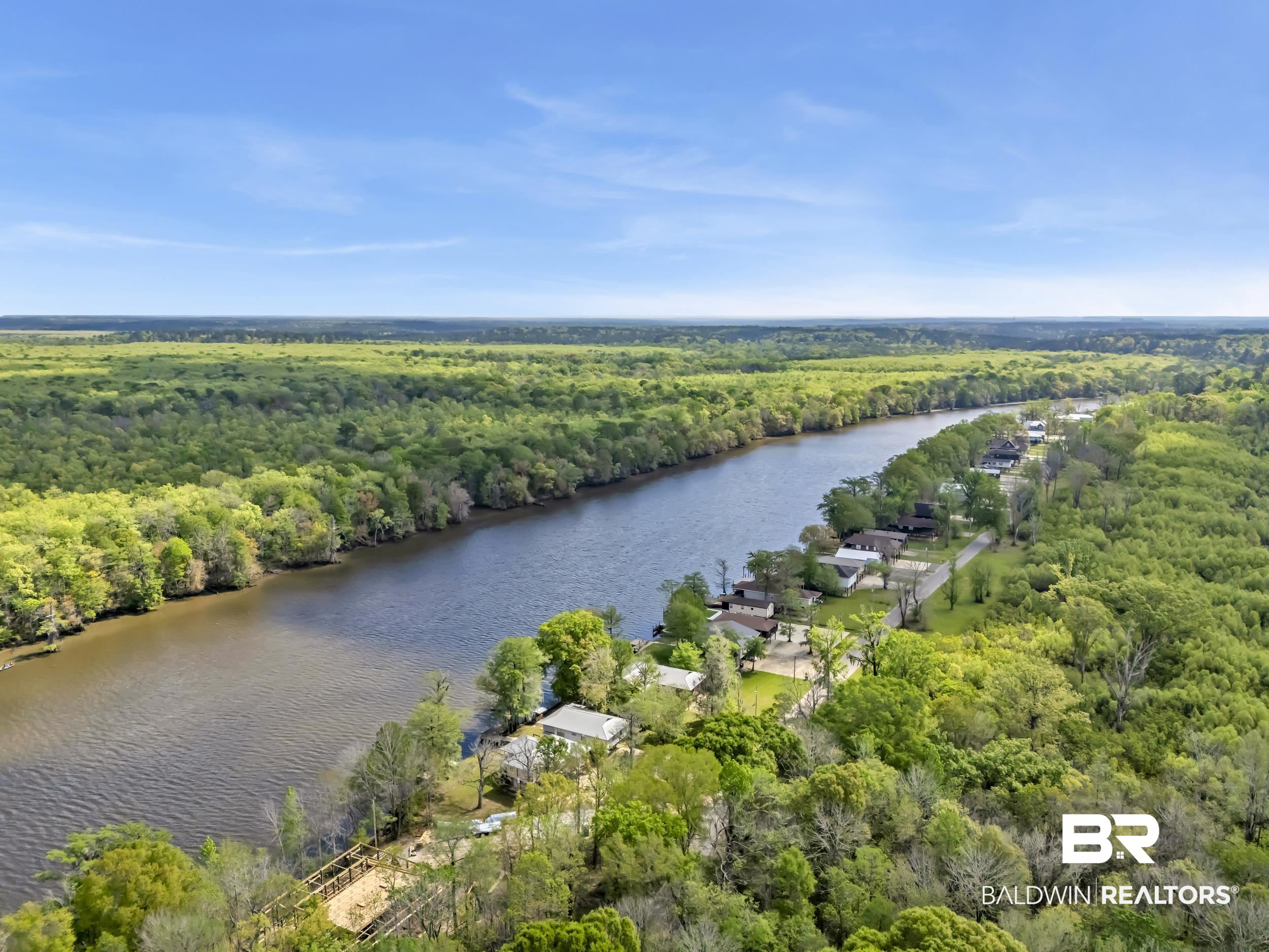 8081 Bryant's Lndg Road Stockton, AL 36579 - Photo 42 of 48 Aerial view of a nearby body of water and a heavily wooded area