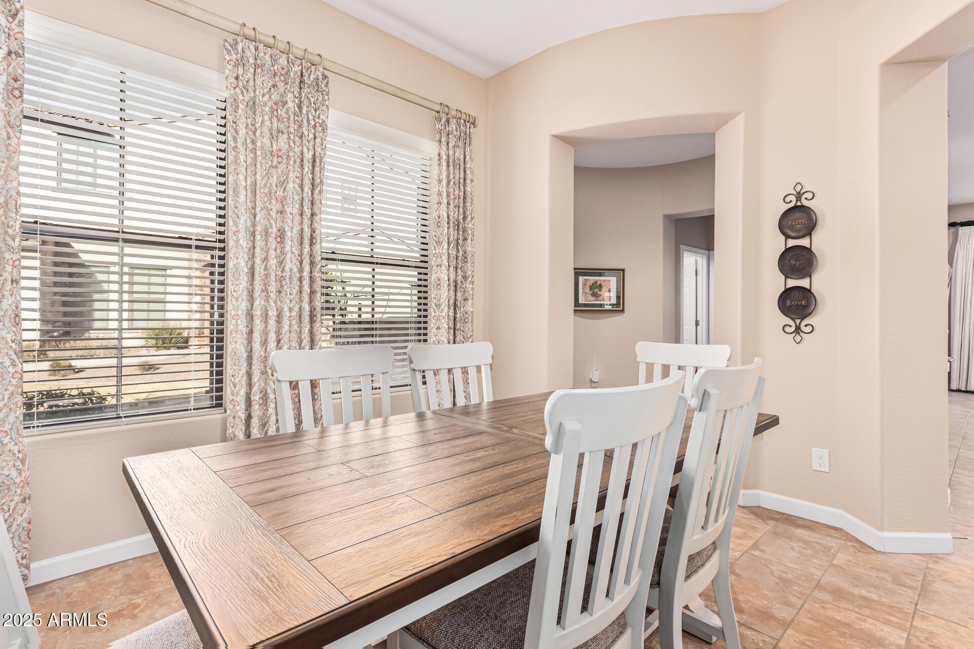 4777 South Fulton Ranch Boulevard, Unit 1027 Chandler, AZ 85248 - Photo 13 of 50 a view of a dining room with furniture and windows