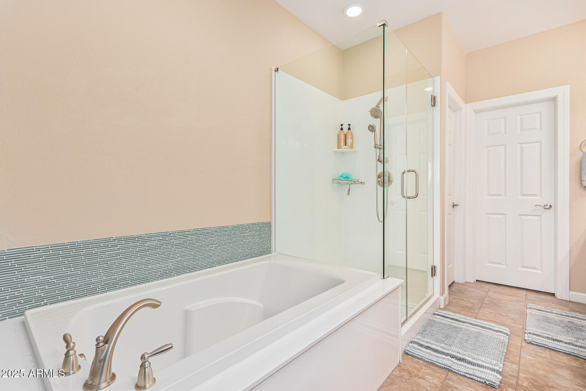 4777 South Fulton Ranch Boulevard, Unit 1027 Chandler, AZ 85248 - Photo 21 of 50 a bathroom with a tub shower and sink