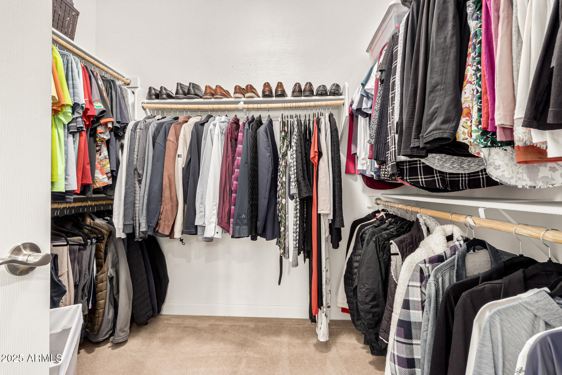4777 South Fulton Ranch Boulevard, Unit 1027 Chandler, AZ 85248 - Photo 23 of 50 a view of walk in closet with clothes and shoes