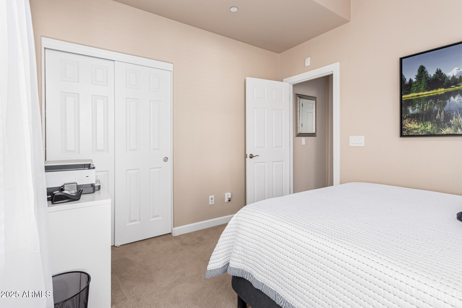 4777 South Fulton Ranch Boulevard, Unit 1027 Chandler, AZ 85248 - Photo 25 of 50 a bedroom with a bed and a painting on the wall