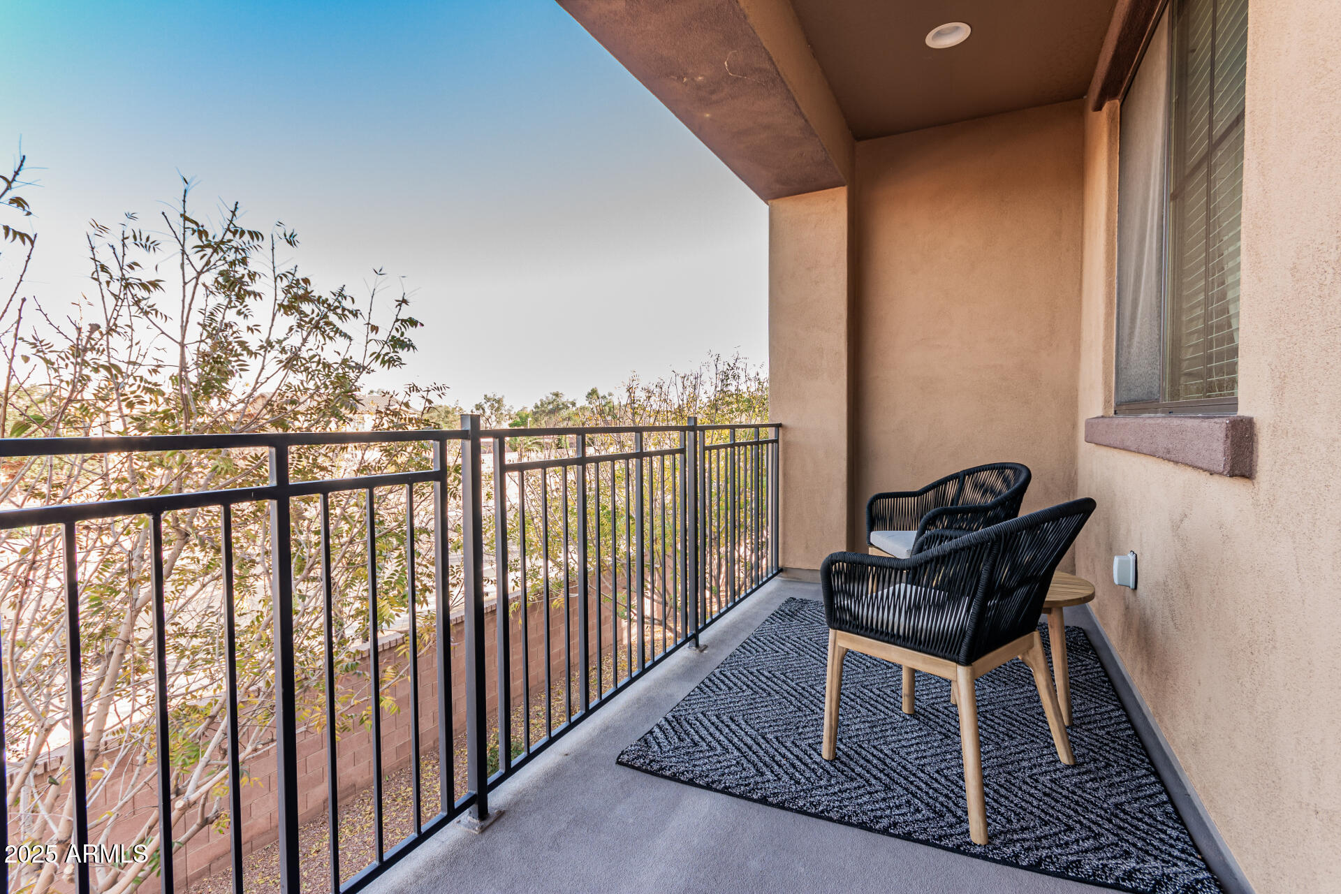 4777 South Fulton Ranch Boulevard, Unit 1027 Chandler, AZ 85248 - Photo 32 of 50 a view of a balcony with chairs
