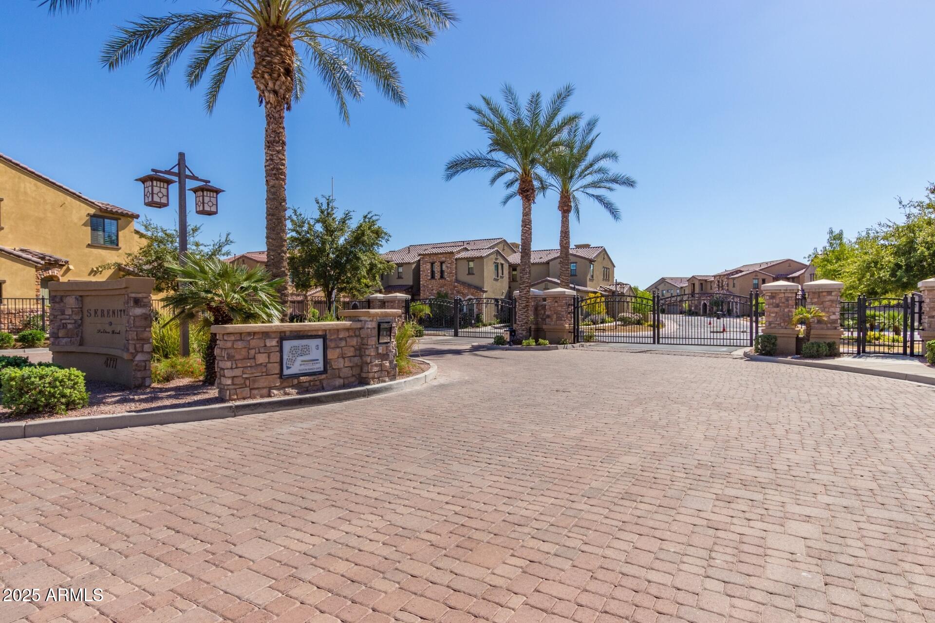 4777 South Fulton Ranch Boulevard, Unit 1027 Chandler, AZ 85248 - Photo 40 of 50 a building view with a garden space