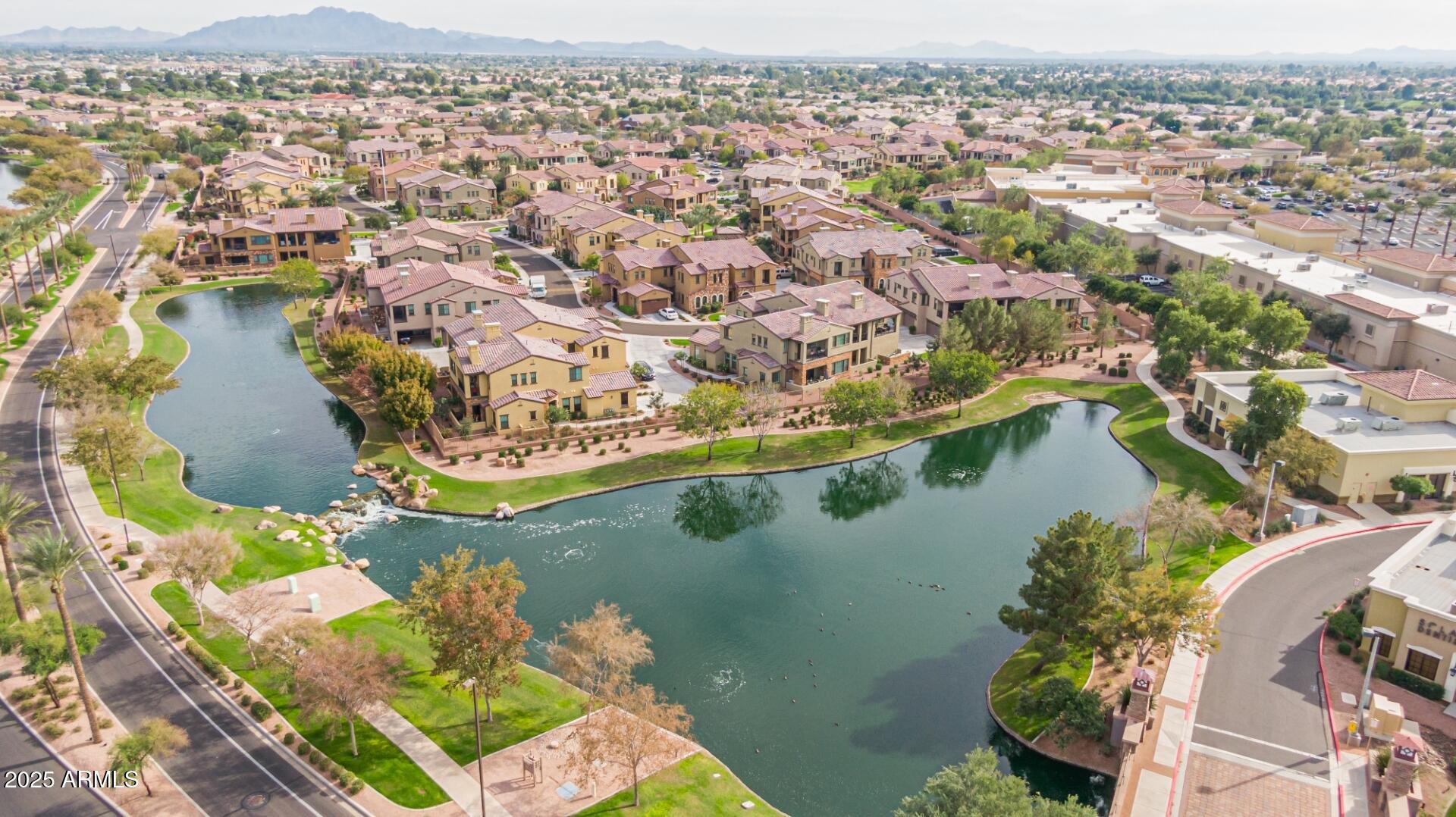4777 South Fulton Ranch Boulevard, Unit 1027 Chandler, AZ 85248 - Photo 46 of 50 an aerial view of residential houses with outdoor space