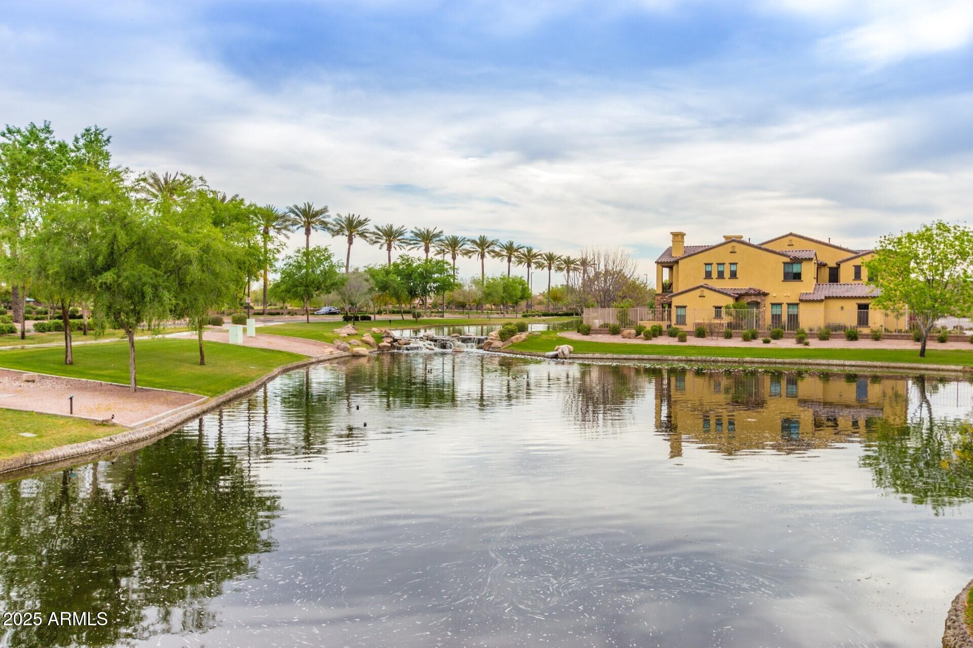 4777 South Fulton Ranch Boulevard, Unit 1027 Chandler, AZ 85248 - Photo 47 of 50 a view of a lake with a city view