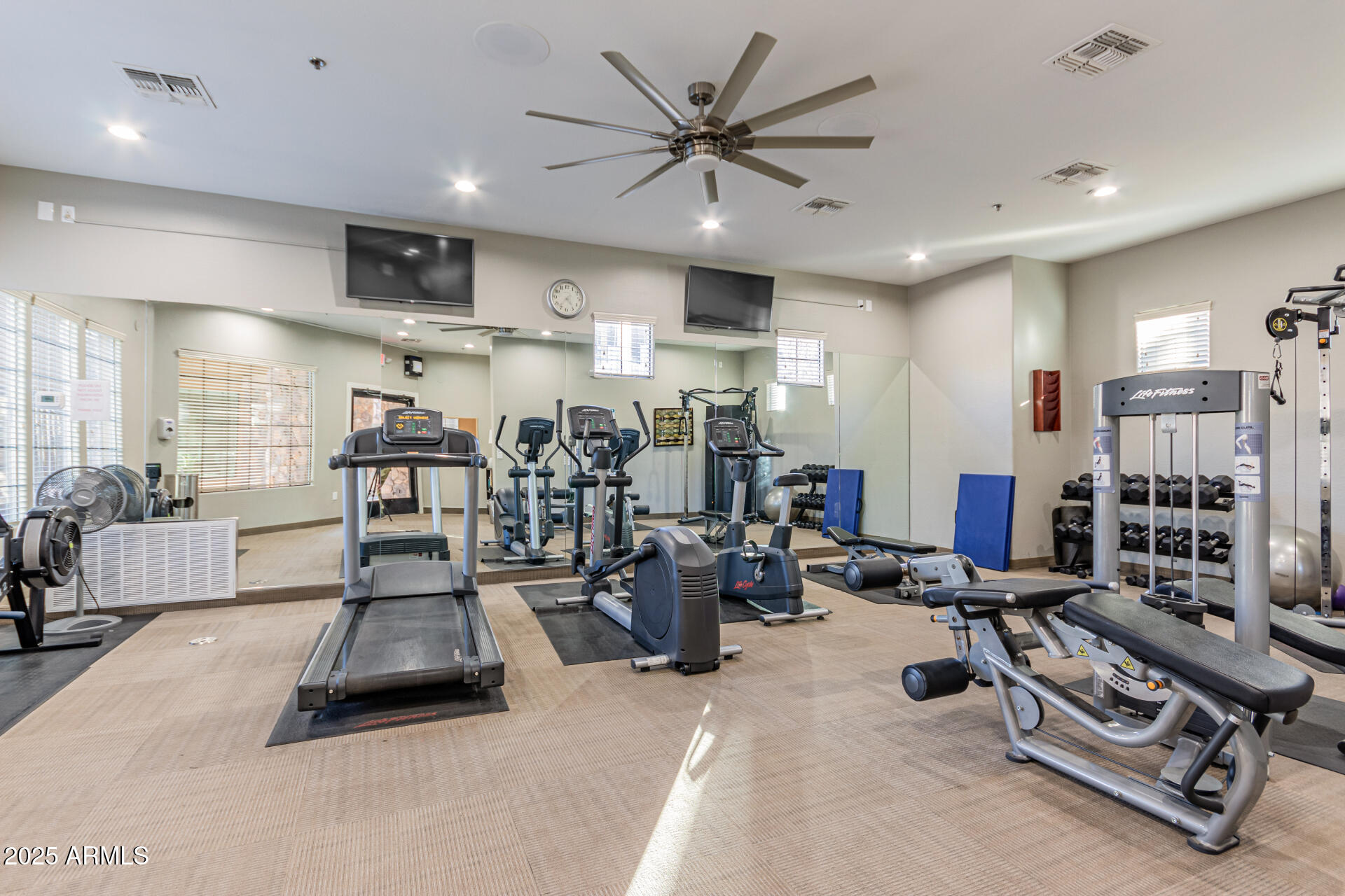 4777 South Fulton Ranch Boulevard, Unit 1027 Chandler, AZ 85248 - Photo 49 of 50 a room with gym equipment and a view of living room
