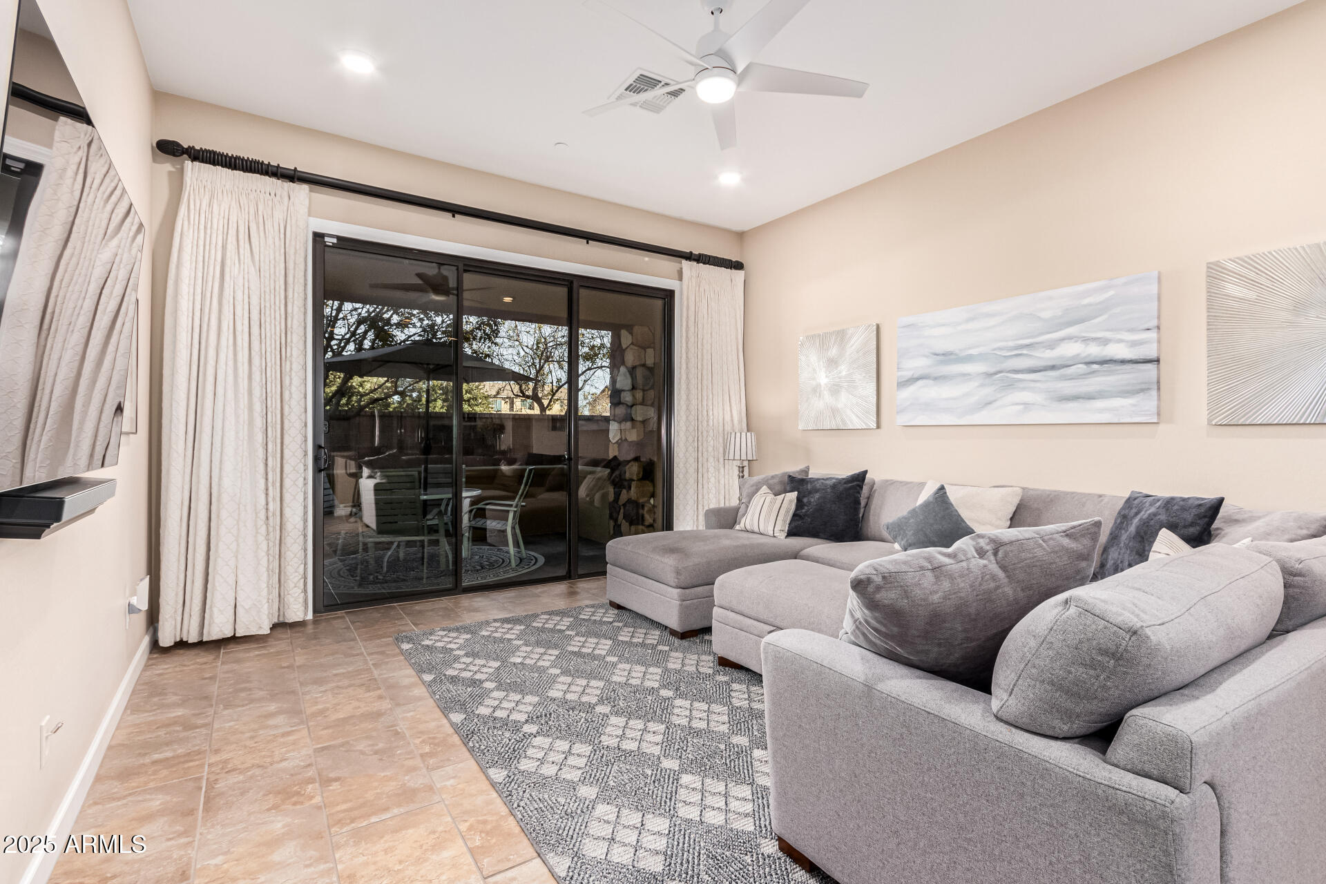 4777 South Fulton Ranch Boulevard, Unit 1027 Chandler, AZ 85248 - Photo 8 of 50 a living room with furniture and a large window