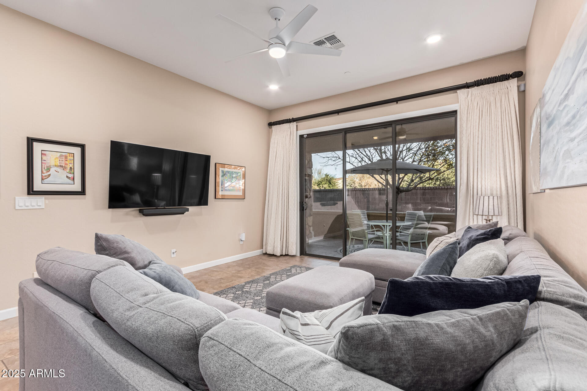 4777 South Fulton Ranch Boulevard, Unit 1027 Chandler, AZ 85248 - Photo 10 of 50 a living room with furniture and a flat screen tv