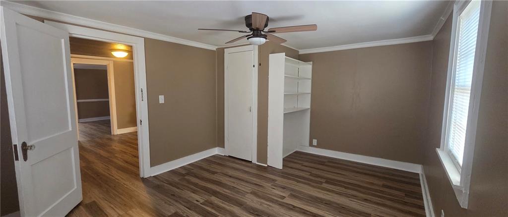 7043 South Goddard Road Stonecrest, GA 30038 - Photo 17 of 33 a view of a hallway with wooden floor