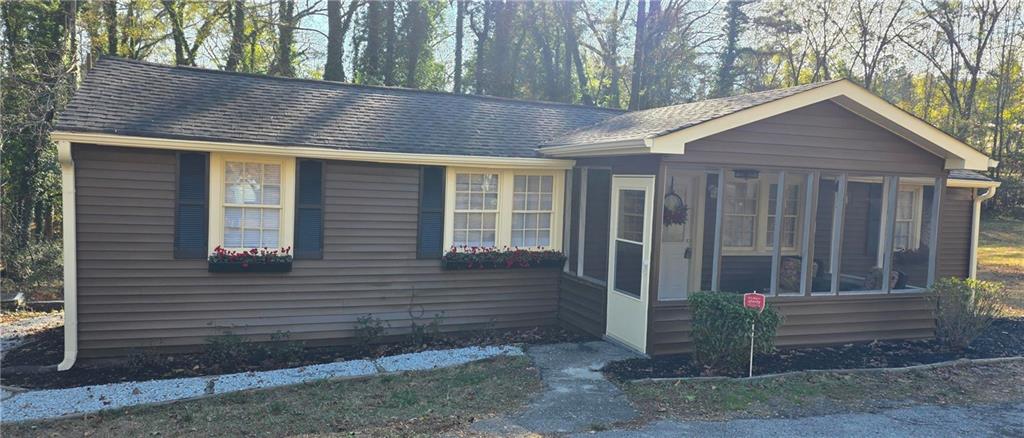 7043 South Goddard Road Stonecrest, GA 30038 - Photo 2 of 33 a view of wooden house